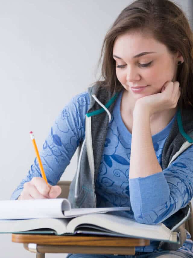 Hispanic girl studying at desk